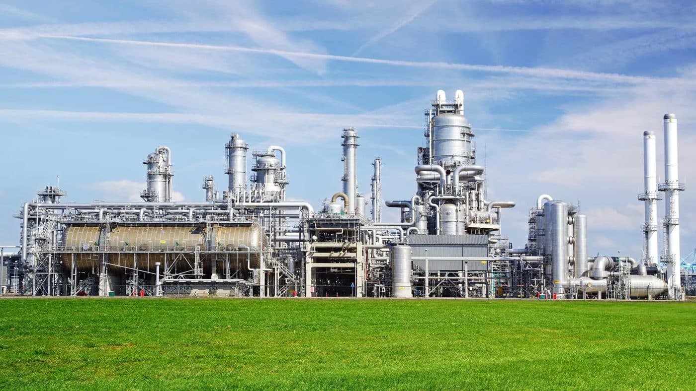 Chemical processing plant under a blue sky